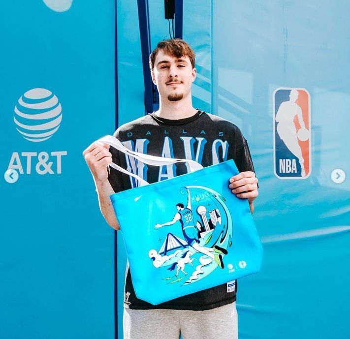 Dallas Mavs player with AT&T Dunk Bus tote